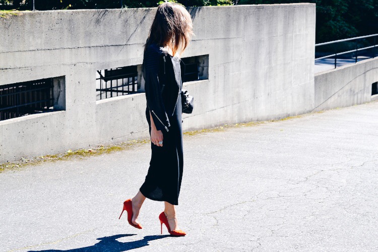 black dress, leather jacket, bright pumps