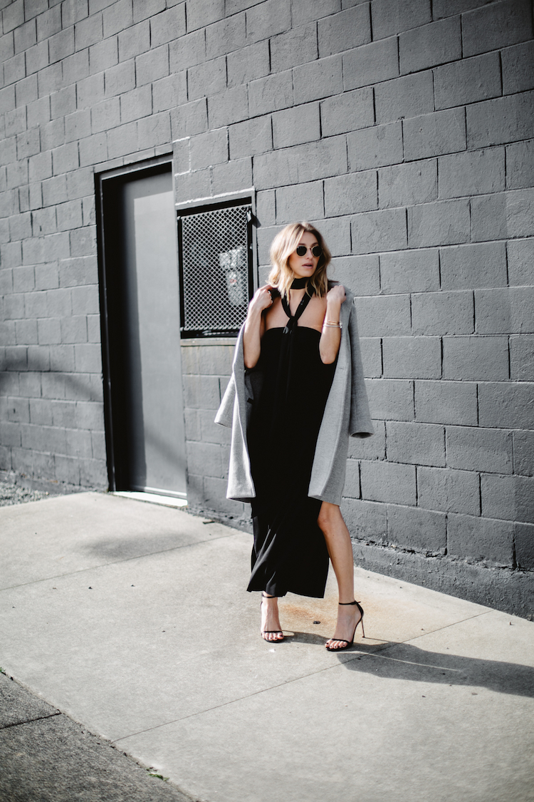 strapless black dress, going out oufit, grey coat over shoulders