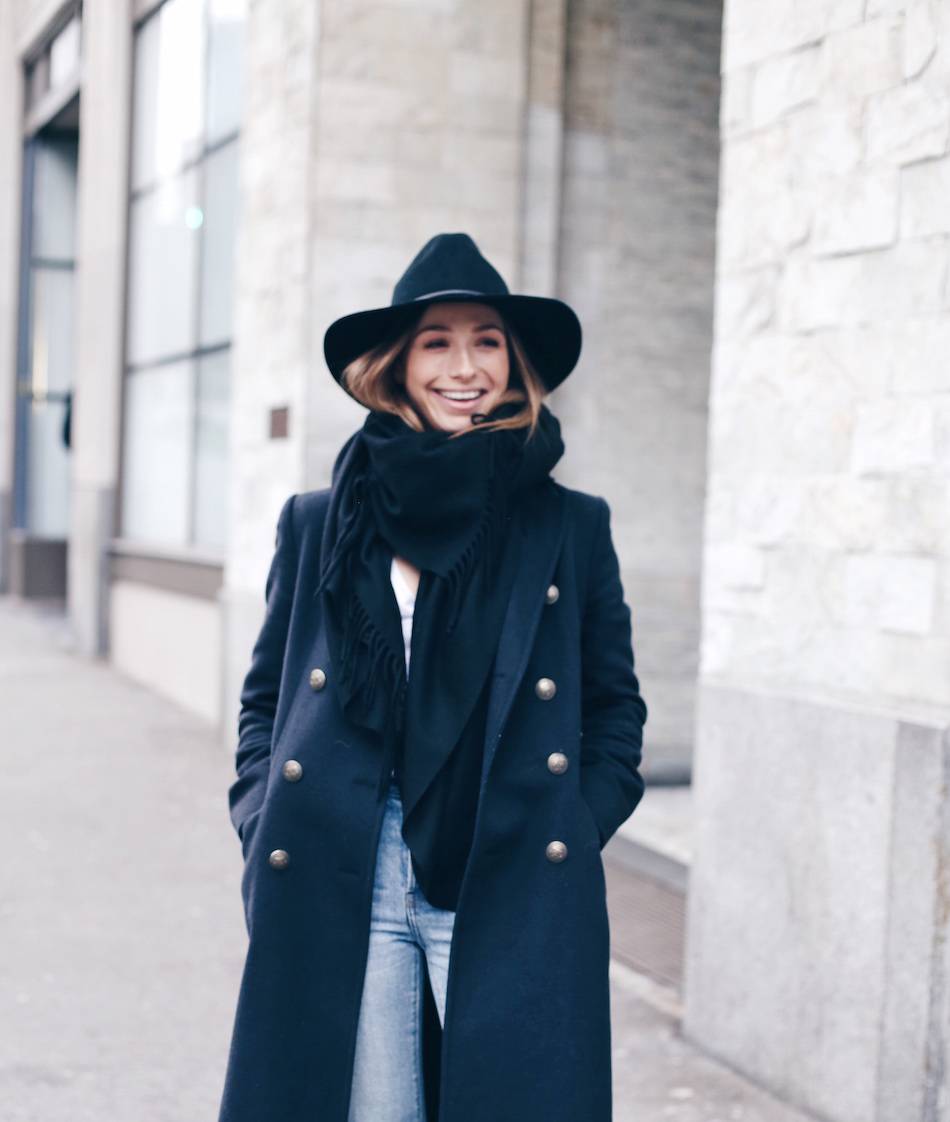 navy coat black hat street style