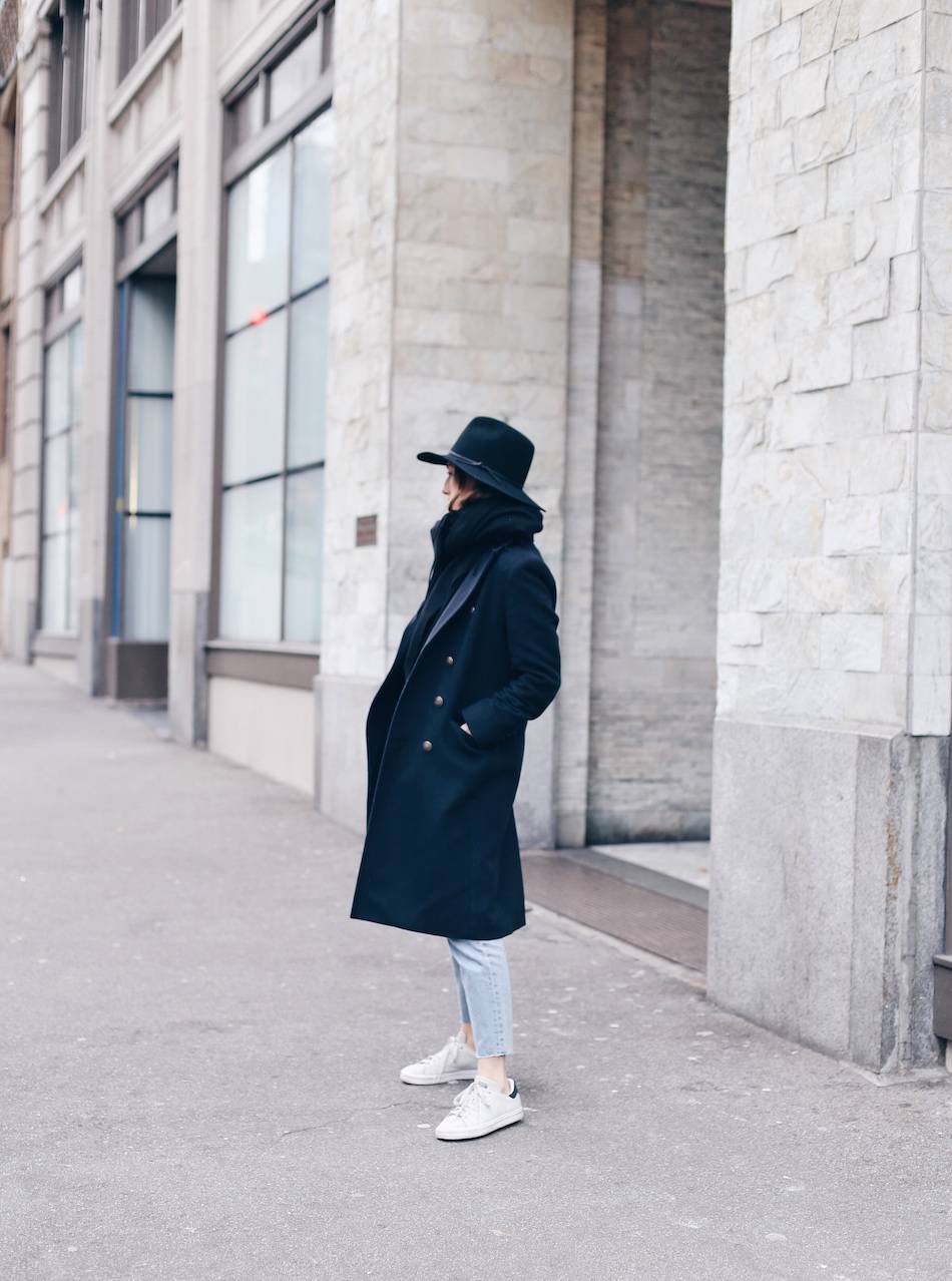 navy coat, white sneakers