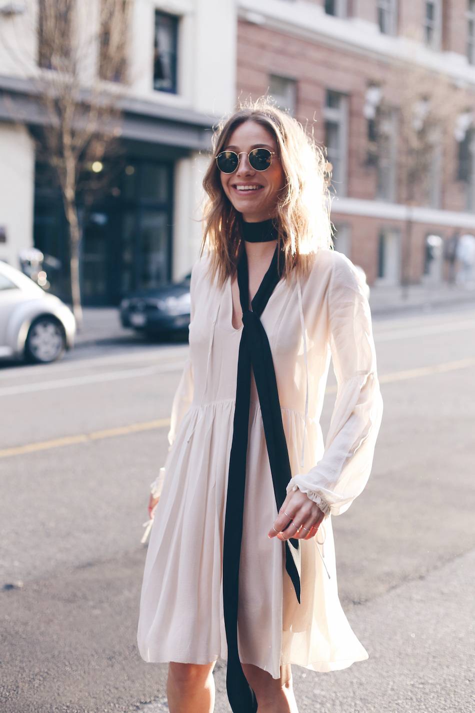 white silk dress, round sunglasses, neck scarf