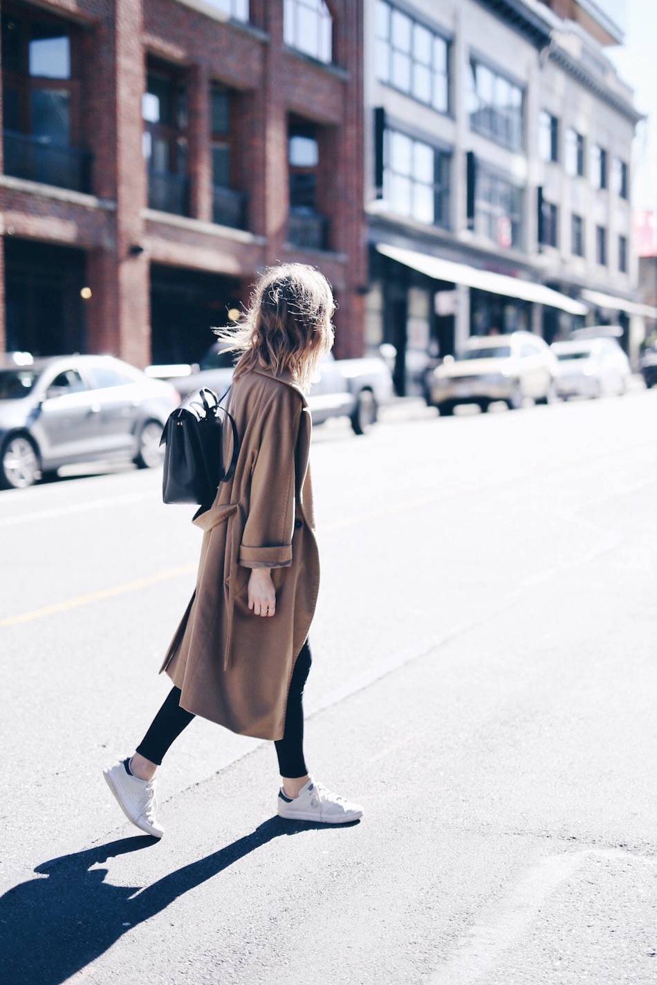 casual camel coat with backpack