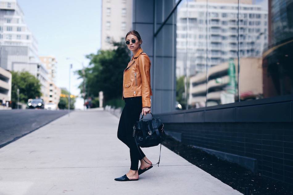 Style expert Jill Lansky of The August Diaries shows what to wear on a weekend in a tan Coach leather jacket, slides and Proenza Schouler PS1 bag