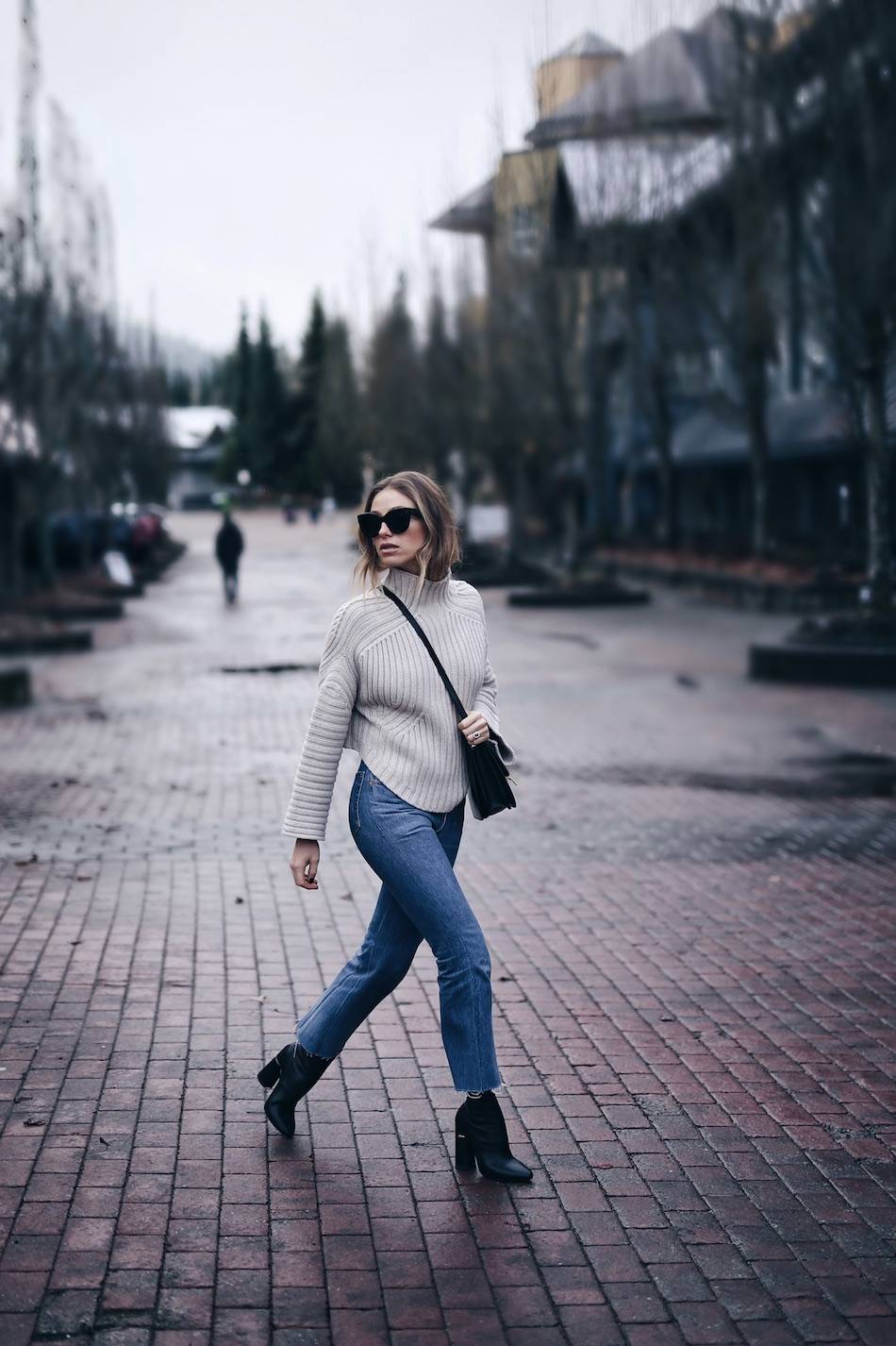 Style and beauty blogger Jill Lansky of The August Diaries Whistler travel diary in redone jeans turtleneck Celine box bag Celine Caty sunglasses