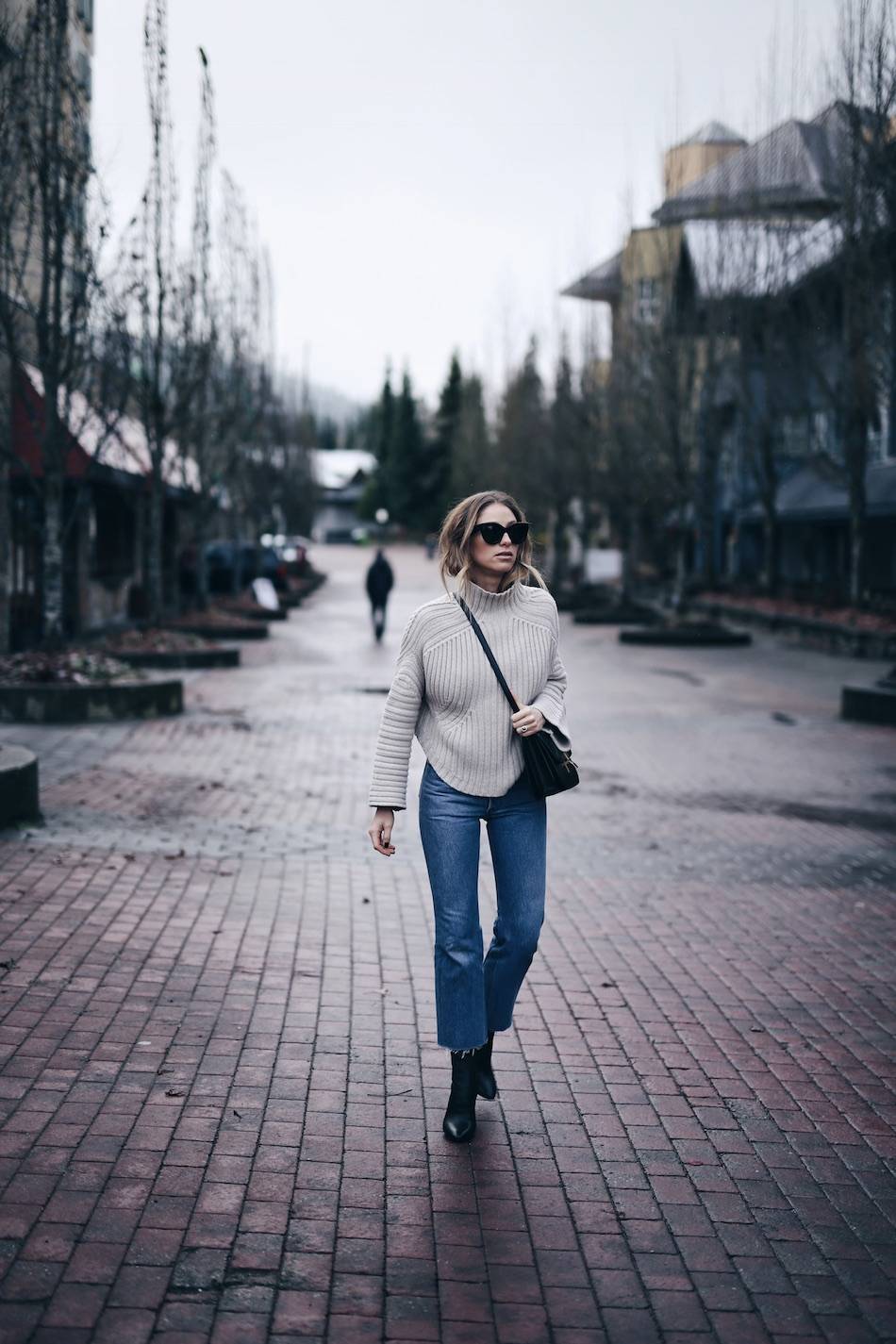 Style and beauty blogger Jill Lansky of The August Diaries Whistler travel diary in redone jeans, turtleneck and Celine box bag