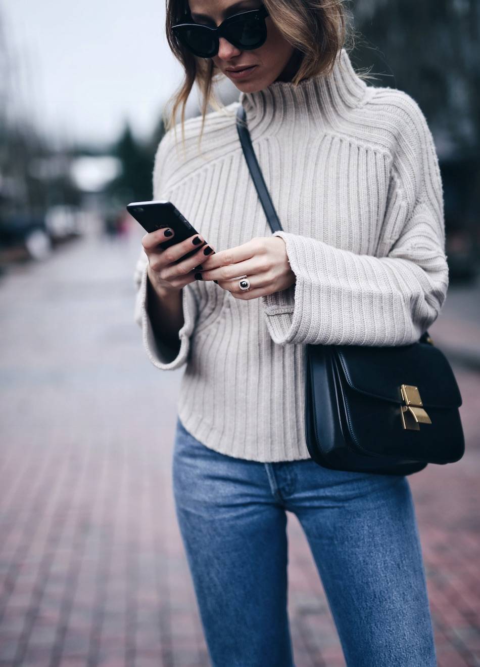 Style and beauty blogger Jill Lansky of The August Diaries Whistler travel diary in turtleneck Celine box bag black diamond engagement ring