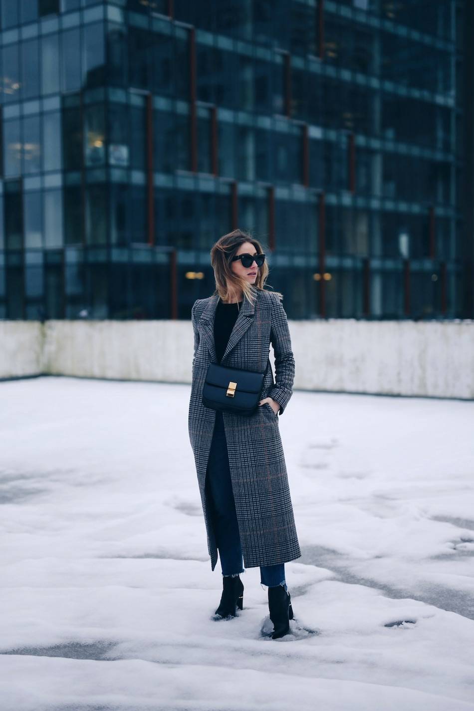 Style and beauty blogger Jill Lansky of The August Diaries in H&M plaid coat with Celine black box bag, GRLFRND jeans