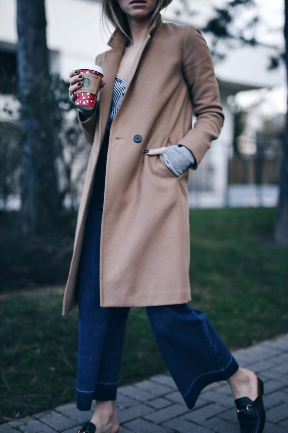 Style and beauty blogger Jill Lansky of The August Diaries in camel coat Gucci loafers, fall winter style