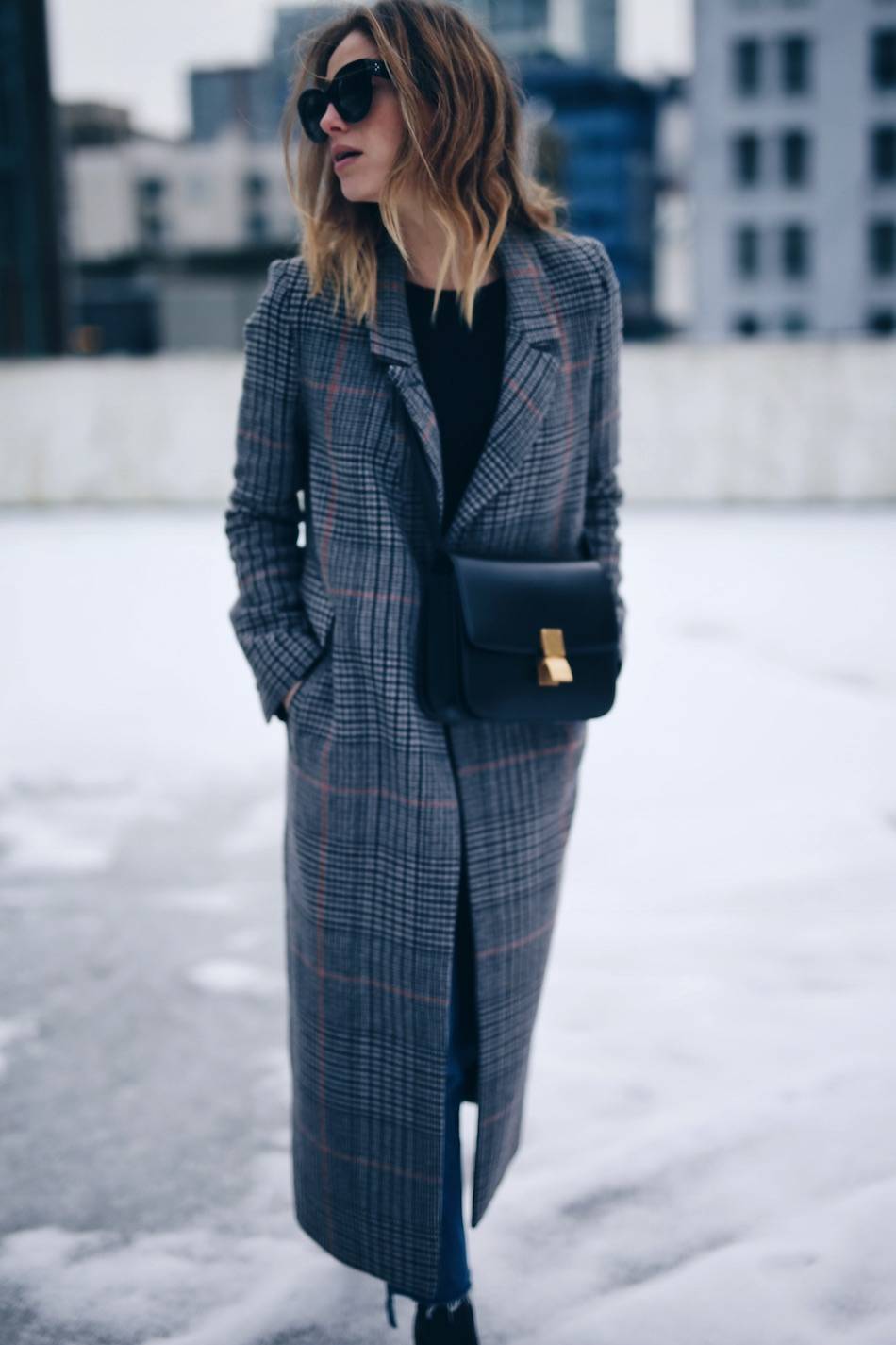 Style and beauty blogger Jill Lansky of The August Diaries on how to stay warm and stylish in the winter in H&M plaid coat, Celine black box bag