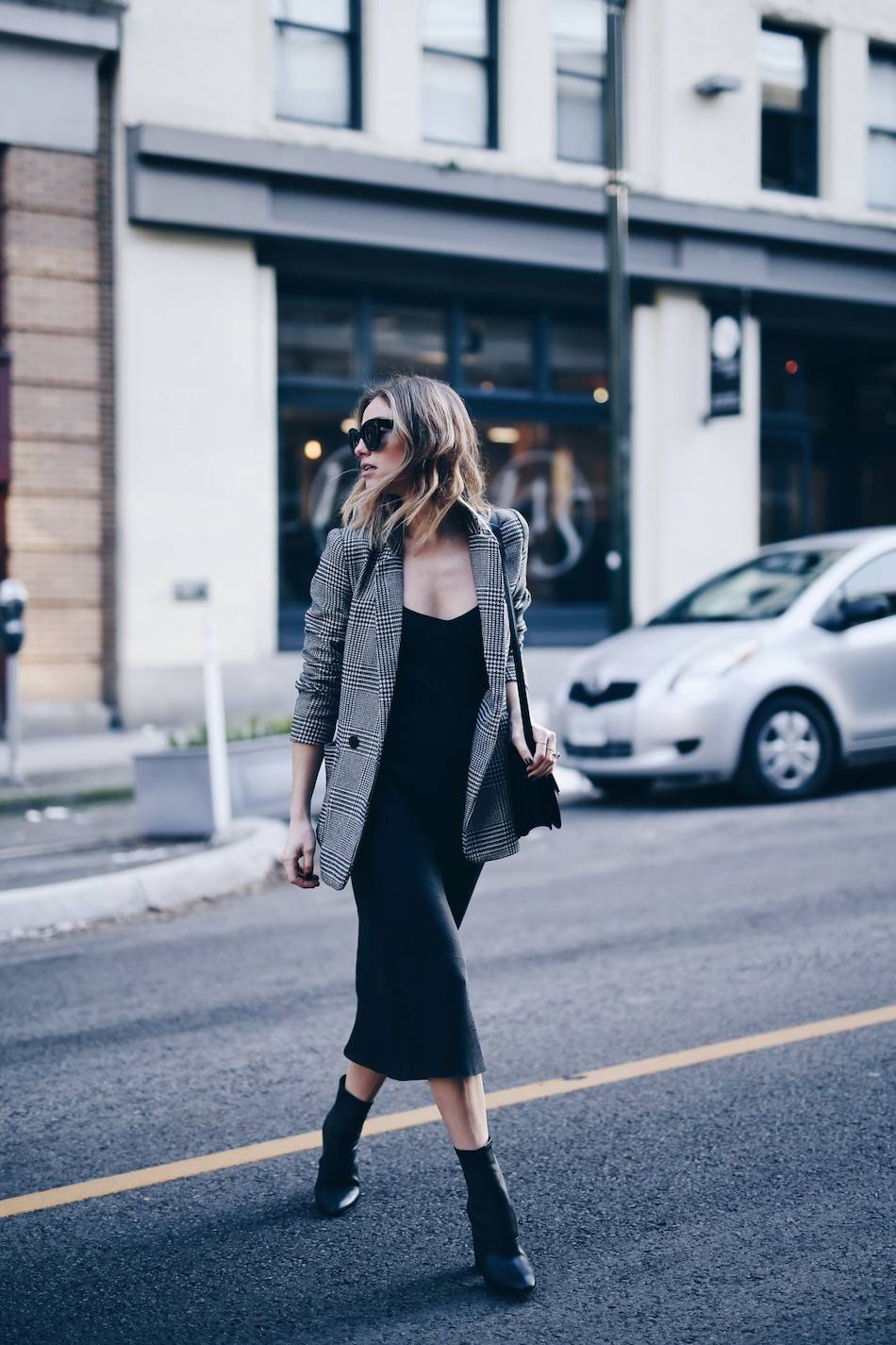 Style and beauty blogger Jill Lansky of The August Diaries on how to wear the perfect slip dress in John Patrick Organic slip dress, plaid boyfriend blazer, 3.1 Phillip Lim boots