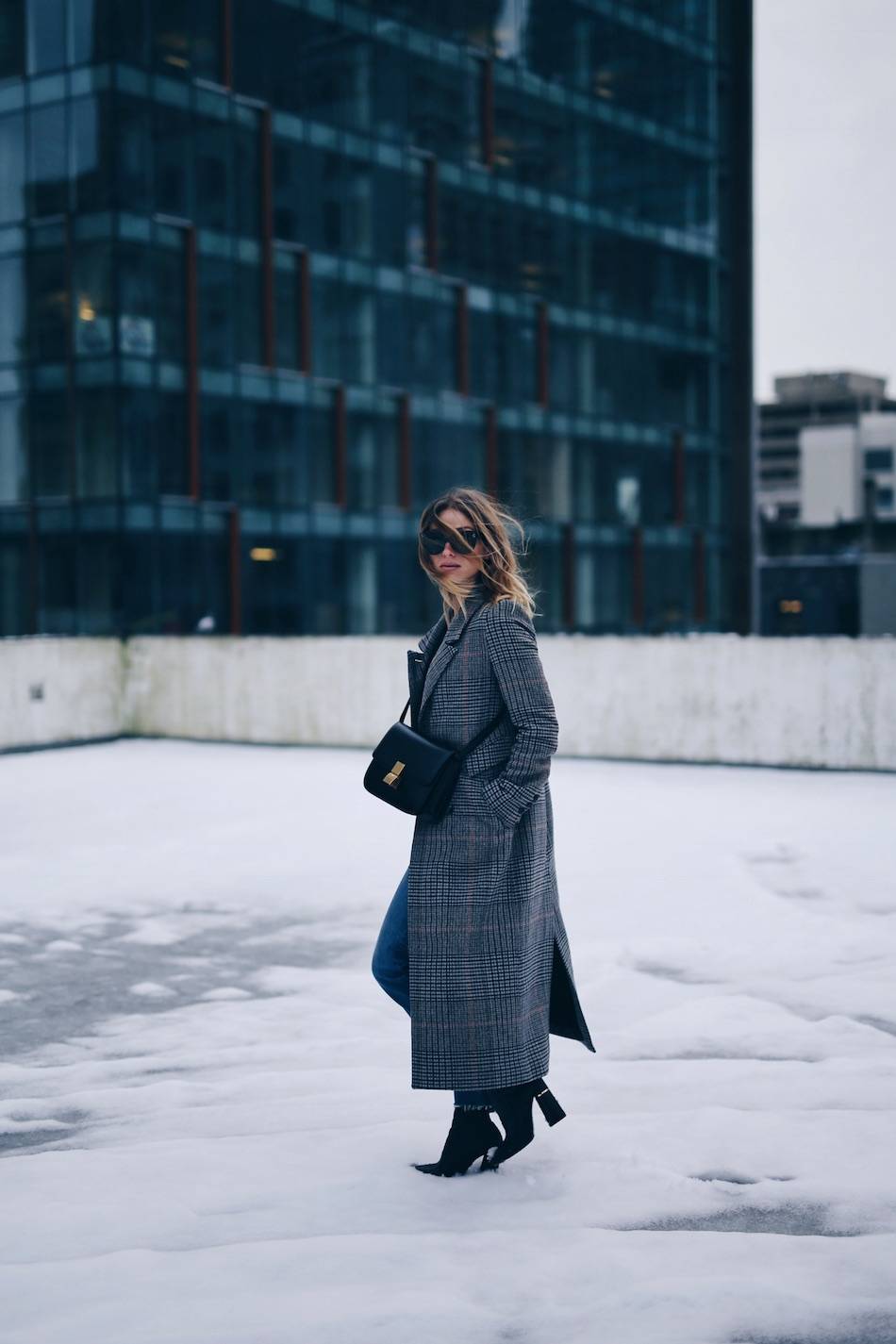 Style and beauty blogger Jill Lansky of The August Diaries on how to wear an H&M plaid coat with Celine black box bag, Celine Caty sunglasses