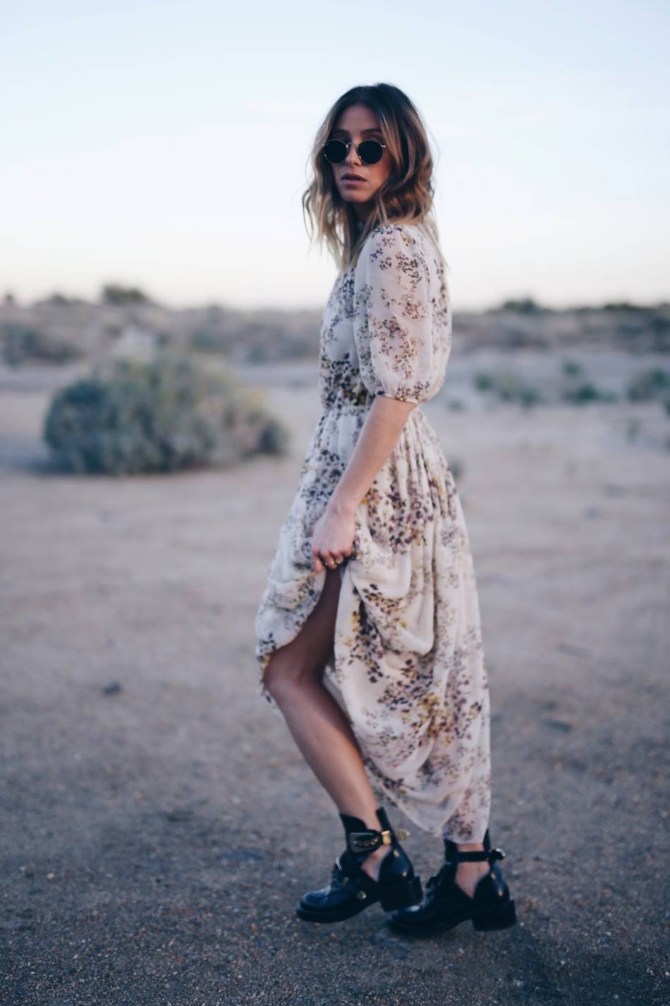 Style and beauty blogger Jill Lansky of The August Diaries in Aritzia silk dress Balenciaga boots, Palm springs desert editorial