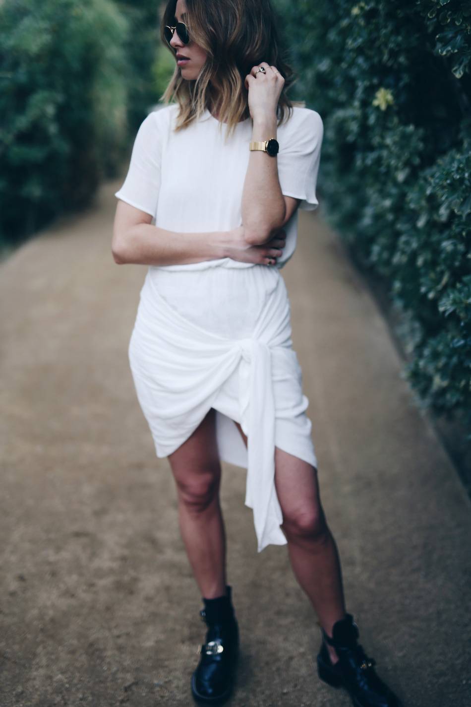 Style-and-beauty-blogger-Jill-Lansky-of-The-August-Diaries-in-white-wrap-Stylestalker-dress-Balenciaga-boots-what-to-wear-on-vacation