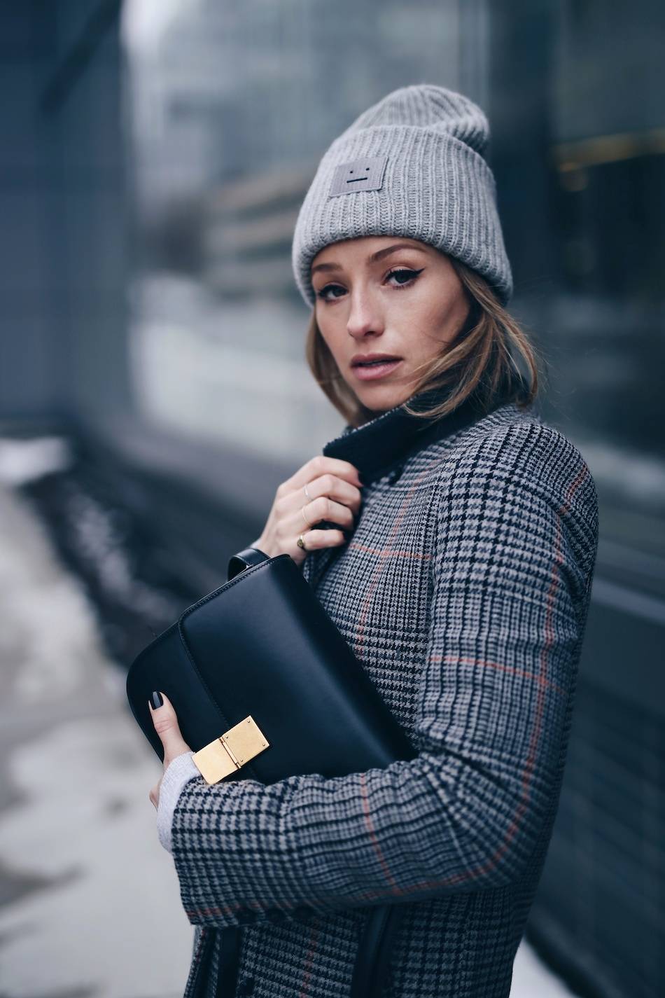 Style and beauty blogger Jill Lansky of The August Diaries on how to stay warm + stylish in the winter in Acne Pansy toque, cat eye makeup