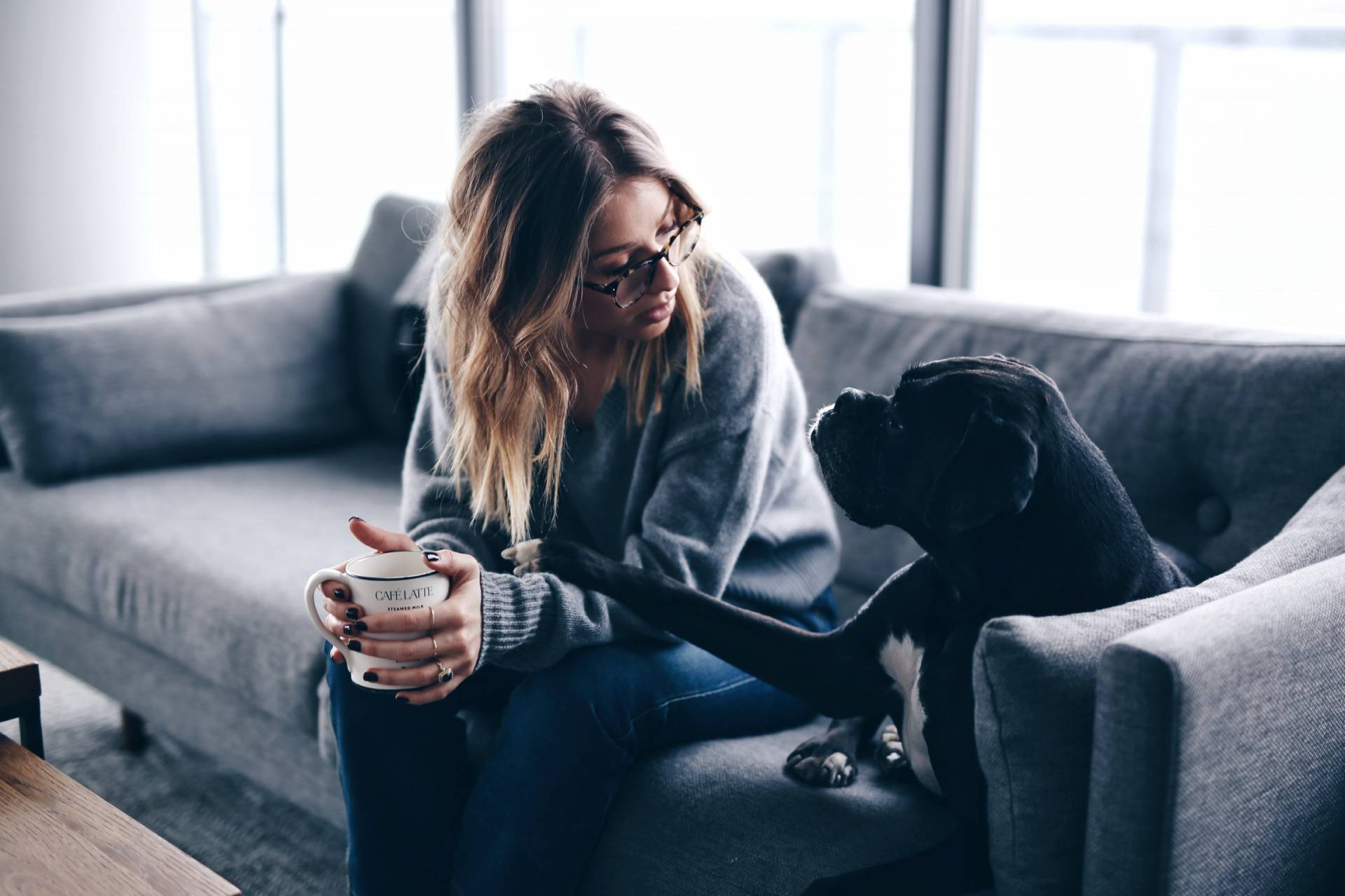 Style and beauty blogger Jill Lansky of The August Diaries shares her simple and minimalist apartment, grey couch, bonlook glasses, black boxer