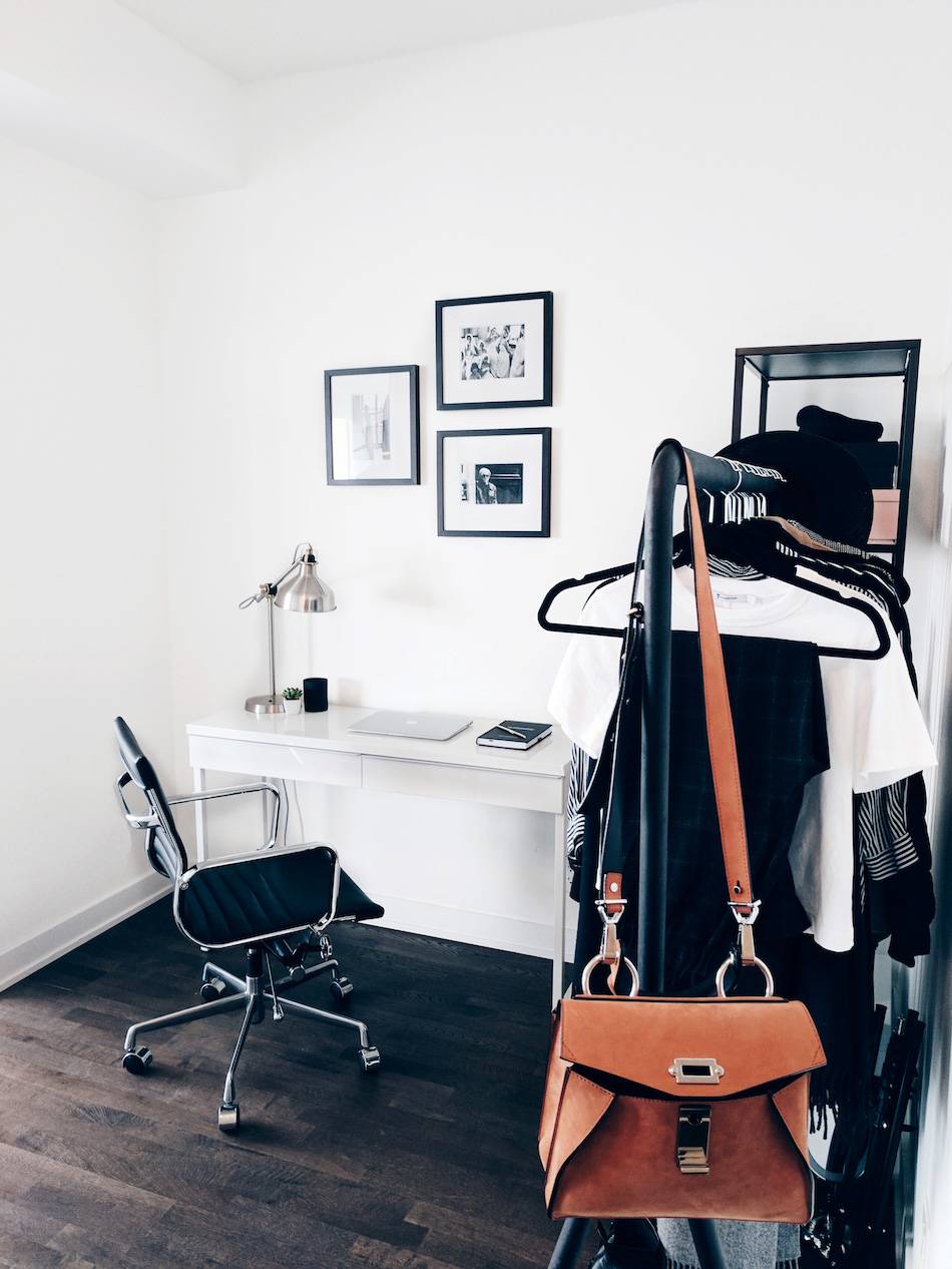 Style and beauty blogger Jill Lansky of The August Diaries shares her simple and minimalist apartment, home office, white desk, gallery wall vintage photographs