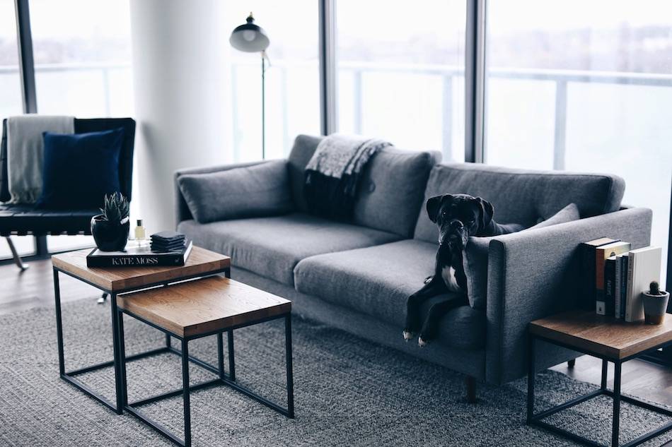 Style and beauty blogger Jill Lansky of The August Diaries shares her simple, minimalistic apartment, interior inspiration, Article wood Taiga tables, grey couch, barcelona chair, grey rug