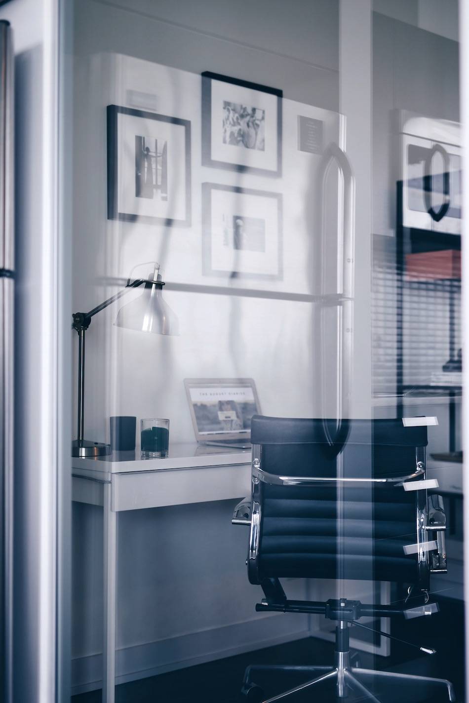 Style and beauty blogger Jill Lansky of The August Diaries shares her simple and minimalist office, interior inspiration, black and silver office chair, black and white gallery wall