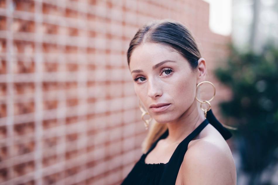 Style and beauty blogger Jill Lansky of The August Diaries 3 steps to looking good on vacation in Aritzia black maxi dress, low ponytail and Cuchara gold statement earrings 