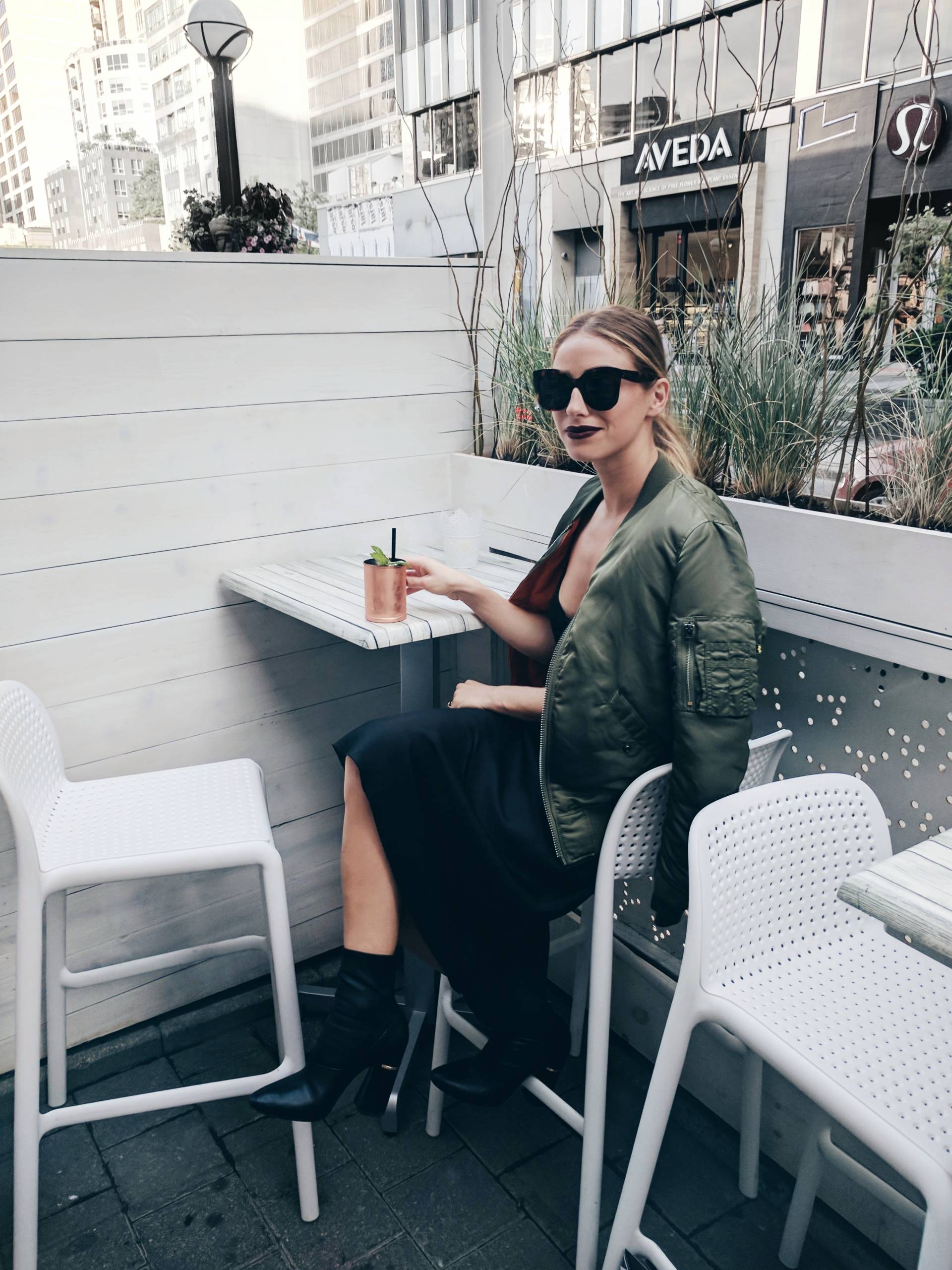 how to style bomber jacket in the summer in alpha industries green bomber jacket, aritzia black dress, celine marta sunglasses
