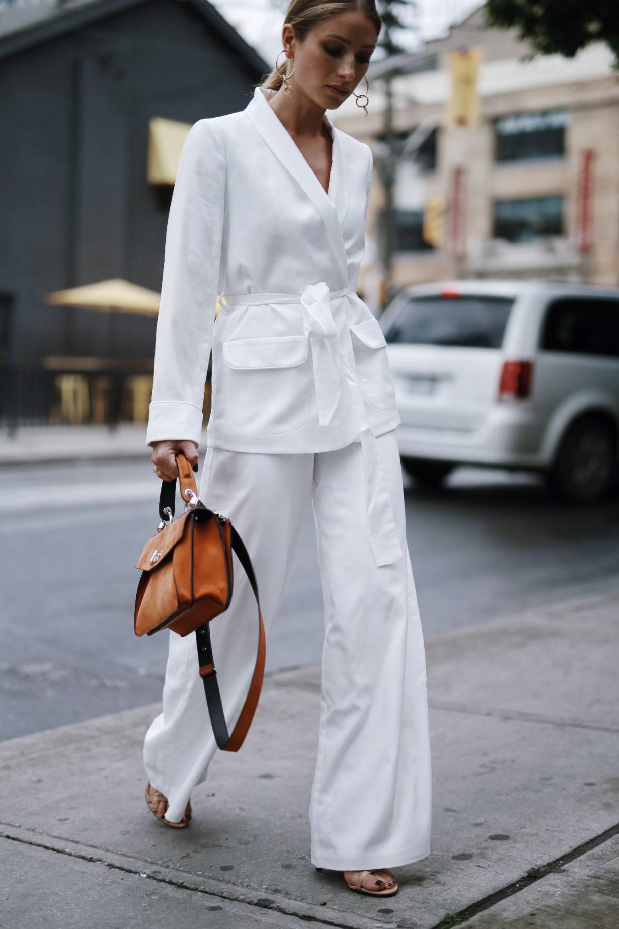 Style and beauty blogger Jill Lansky of The August Diaries wearing a white silk summer suit