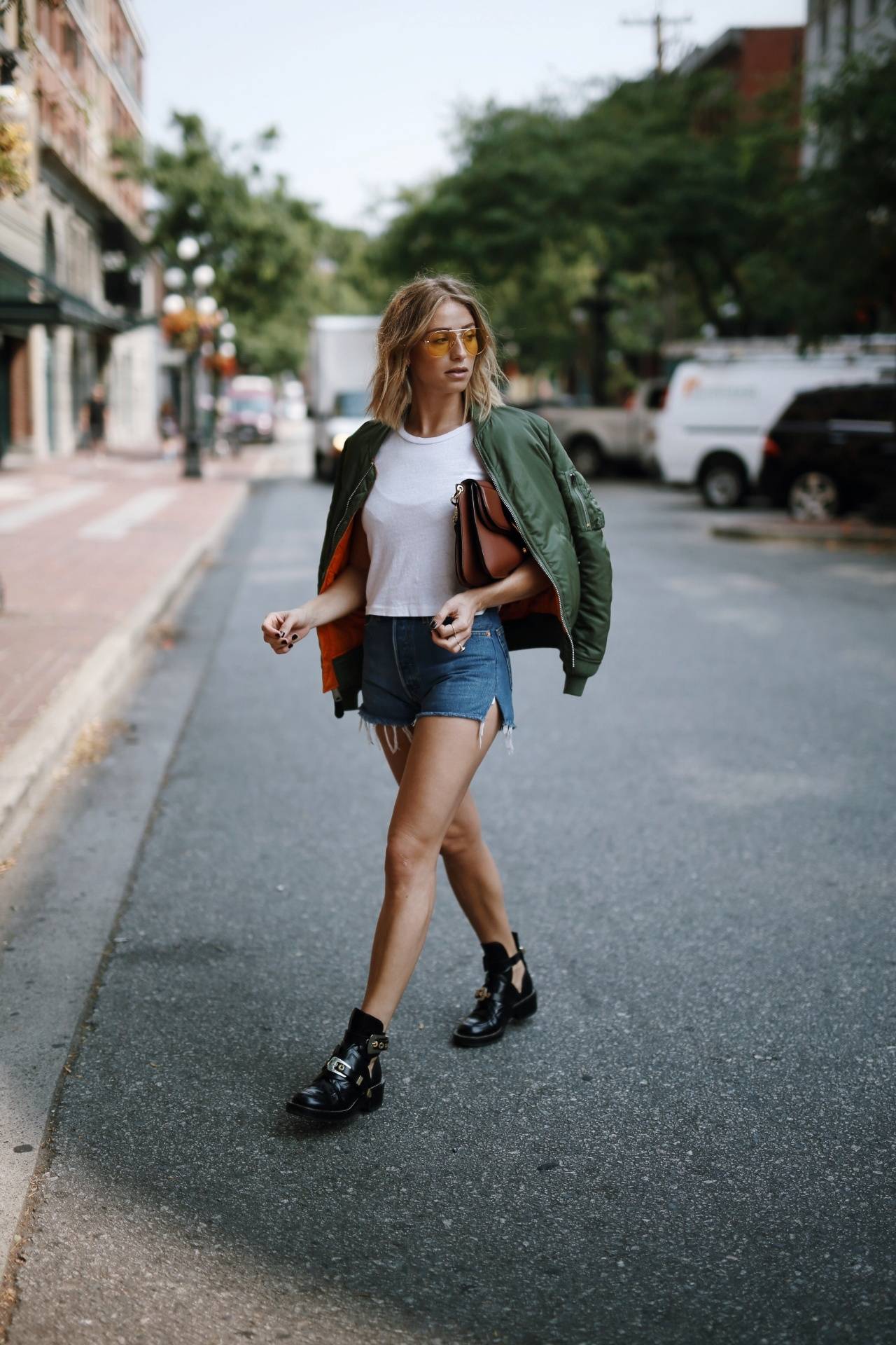 Style and beauty blogger Jill Lansky of The August Diaries on how to mix comfort and style in Re/Done denim shorts and white tee, balenciaga boots