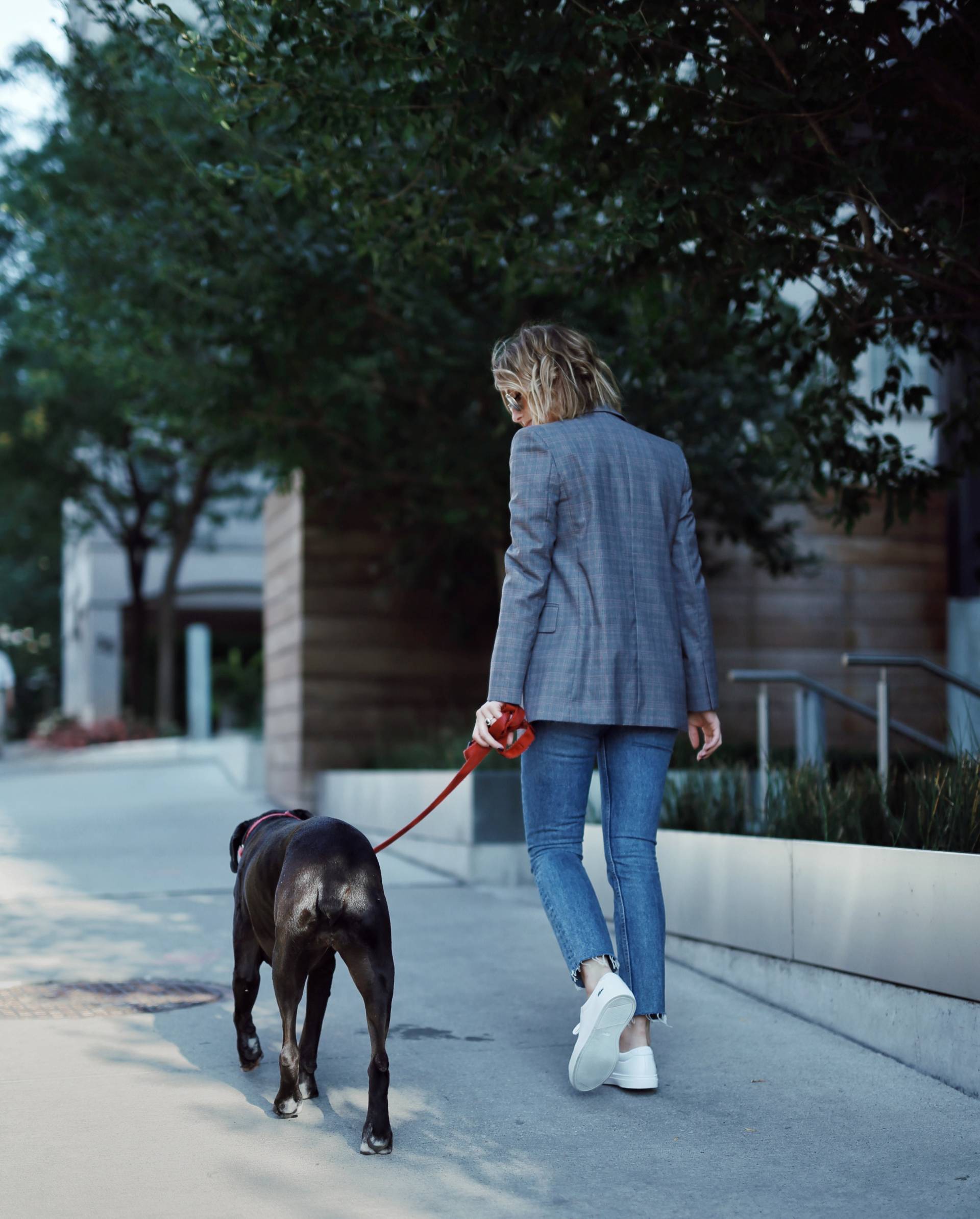Style and beauty blogger Jill Lansky of The August Diaries walking black boxer