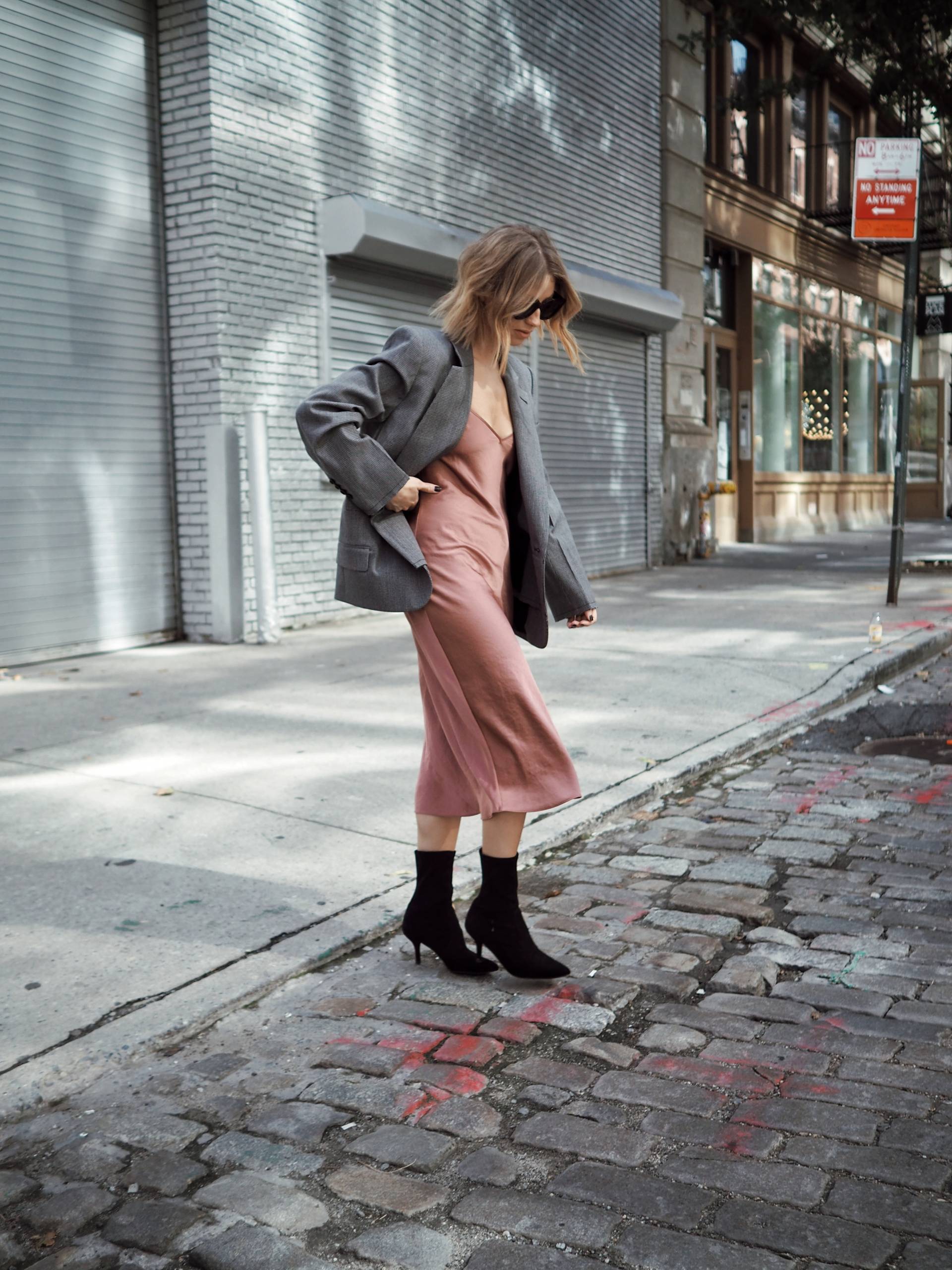 Style and beauty blogger Jill Lansky of the August Diaries in go to fall outfit slip dress, boyfriend blazer, stuart weitzman cling booties